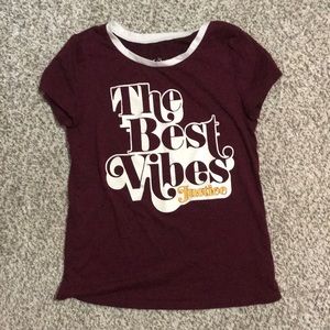 maroon shortsleeved shirt